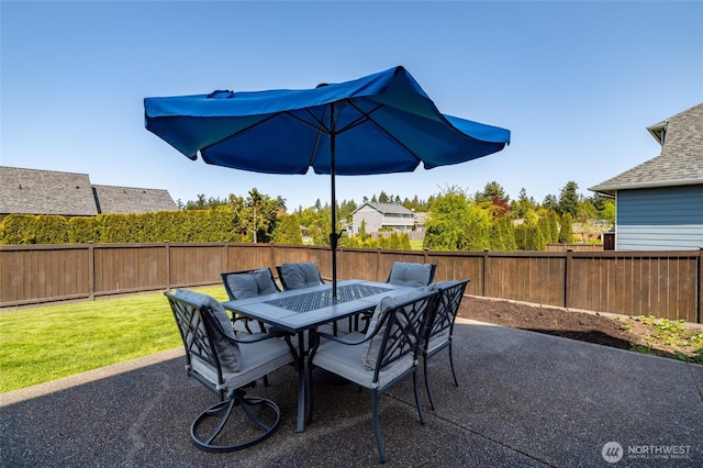 view of patio / terrace featuring outdoor dining area and a fenced backyard