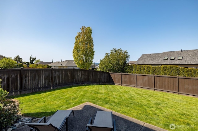 view of yard featuring a fenced backyard
