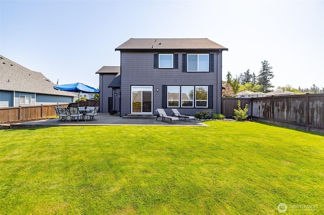 rear view of house featuring a fenced backyard, a patio, entry steps, and a yard