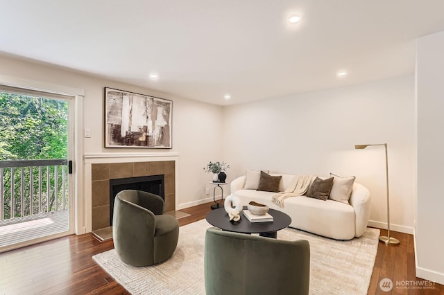 3018 128th Ave SE Unit 10, Bellevue, WA 98005 - living room with baseboards, recessed lighting, wood finished floors, and a tile fireplace