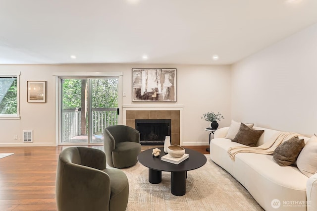 3018 128th Ave SE Unit 10, Bellevue, WA 98005 - living area featuring baseboards, wood finished floors, and a fireplace