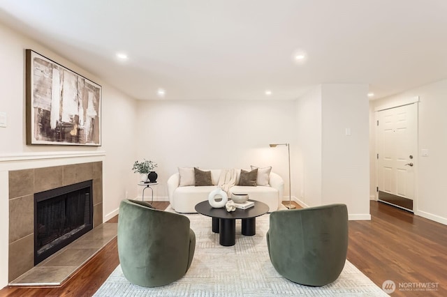 3018 128th Ave SE Unit 10, Bellevue, WA 98005 - living room with recessed lighting, baseboards, wood finished floors, and a tiled fireplace
