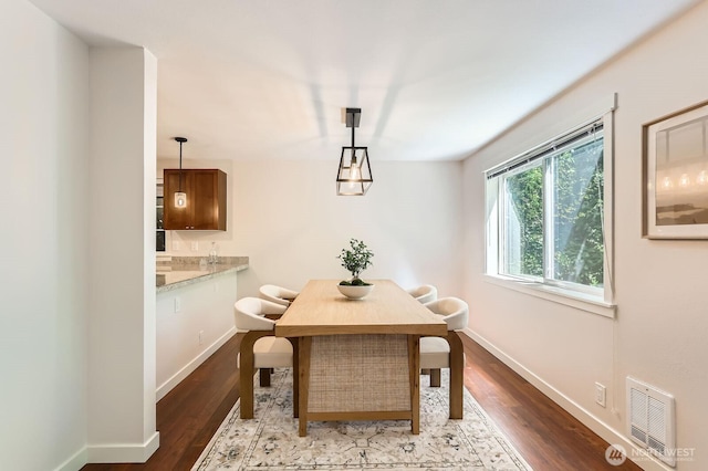 3018 128th Ave SE Unit 10, Bellevue, WA 98005 - dining area with baseboards, wood finished floors, and visible vents