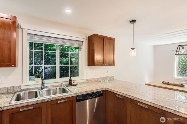 3018 128th Ave SE Unit 10, Bellevue, WA 98005 - kitchen featuring brown cabinets, hanging light fixtures, a sink, tile countertops, and stainless steel dishwasher