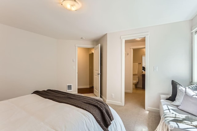 3018 128th Ave SE Unit 10, Bellevue, WA 98005 - bedroom with visible vents, baseboards, and light colored carpet