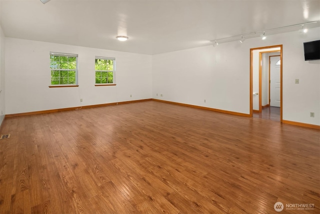 110 NW 110th St, Seattle, WA 98177 - empty room with rail lighting, visible vents, baseboards, and light wood finished floors