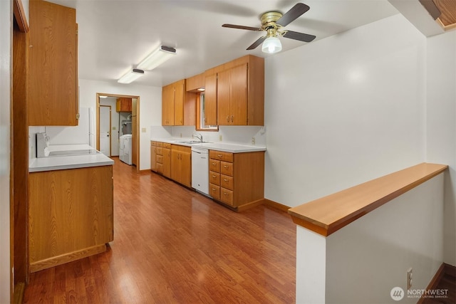 110 NW 110th St, Seattle, WA 98177 - kitchen featuring white dishwasher, washer / dryer, a sink, and wood finished floors