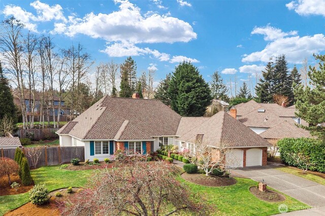 4799 171st Ave SE, Bellevue, WA 98006 - single story home with a chimney, a front yard, fence, aphalt driveway, and an attached garage