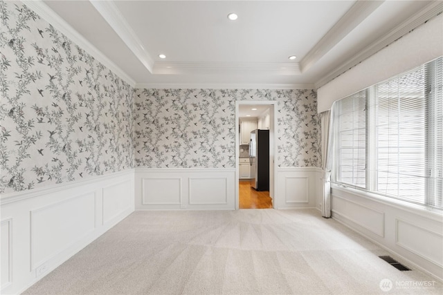 4799 171st Ave SE, Bellevue, WA 98006 - empty room featuring visible vents, a decorative wall, recessed lighting, light colored carpet, and a wainscoted wall