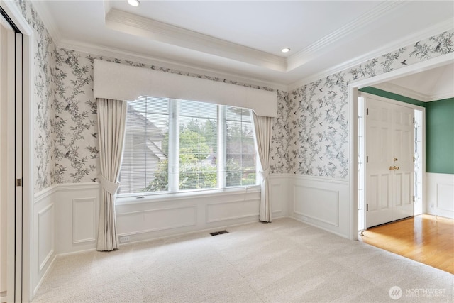 4799 171st Ave SE, Bellevue, WA 98006 - unfurnished room featuring visible vents, crown molding, recessed lighting, light colored carpet, and a wainscoted wall