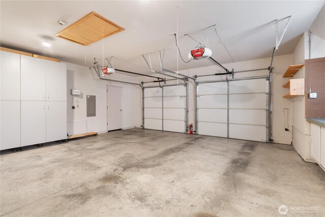 4799 171st Ave SE, Bellevue, WA 98006 - garage with a garage door opener and electric panel
