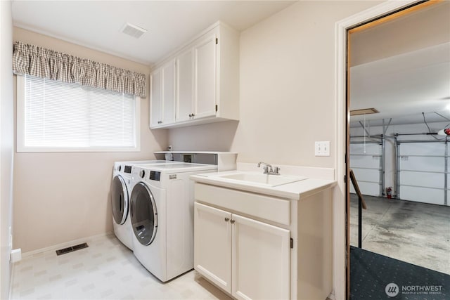4799 171st Ave SE, Bellevue, WA 98006 - clothes washing area featuring washing machine and clothes dryer, baseboards, visible vents, and cabinet space