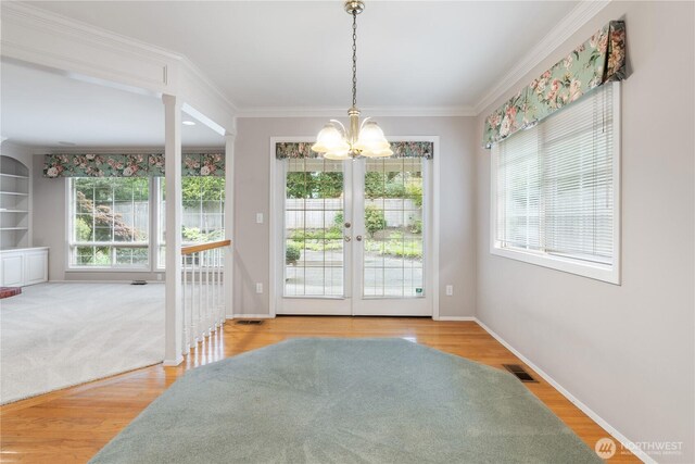 4799 171st Ave SE, Bellevue, WA 98006 - entryway featuring an inviting chandelier, ornamental molding, wood finished floors, and visible vents