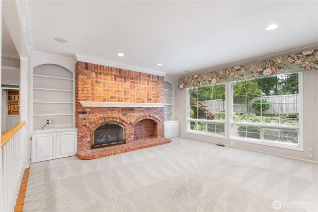 4799 171st Ave SE, Bellevue, WA 98006 - unfurnished living room with crown molding, carpet floors, a brick fireplace, recessed lighting, and built in shelves