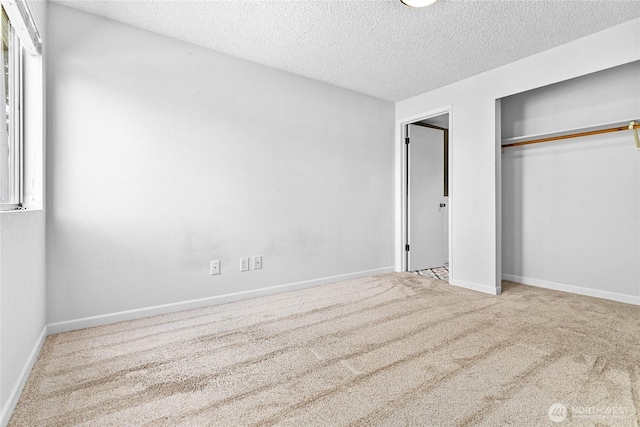 1346 Orleans, Bellingham, WA 98229 - unfurnished bedroom with a textured ceiling, carpet flooring, a closet, and baseboards