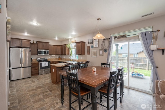 dining room featuring recessed lighting and visible vents