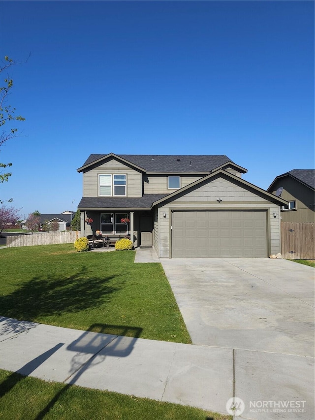 800 S Hamilton Rd, Moses Lake, WA 98837 - traditional-style home with an attached garage, concrete driveway, and covered porch