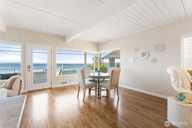 dining room with visible vents, a wealth of natural light, and wood finished floors
