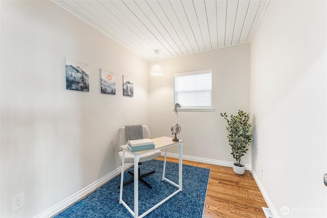 home office featuring baseboards, wood ceiling, and wood finished floors