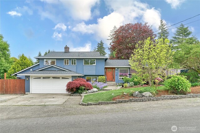 15722 62nd Pl NE, Kenmore, WA 98028 - view of front of property featuring a chimney, concrete driveway, an attached garage, and a shingled roof