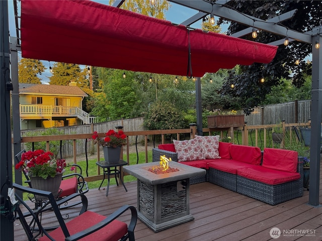 15722 62nd Pl NE, Kenmore, WA 98028 - wooden deck featuring a fenced backyard and an outdoor living space with a fire pit