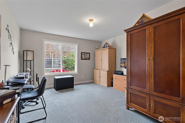 home office featuring baseboards and light carpet