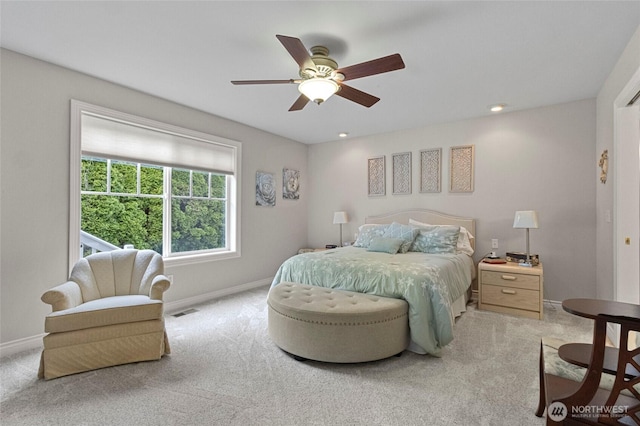 carpeted bedroom with baseboards and ceiling fan