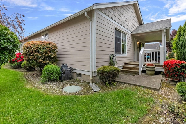 view of home's exterior with a yard