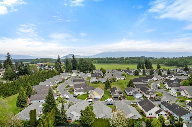 birds eye view of property with a residential view and a mountain view