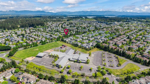 birds eye view of property with a mountain view and a residential view