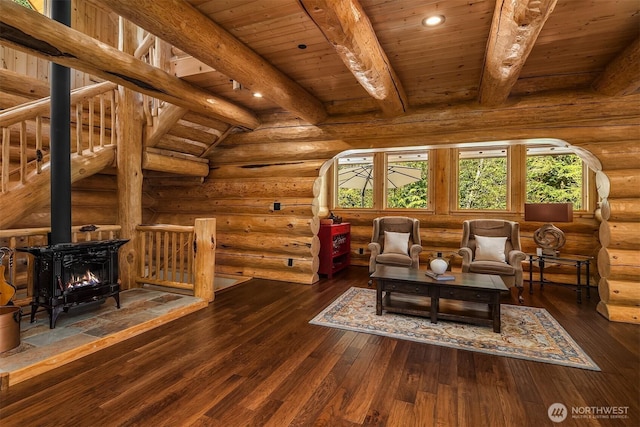 living area with recessed lighting, log walls, beam ceiling, and wood ceiling