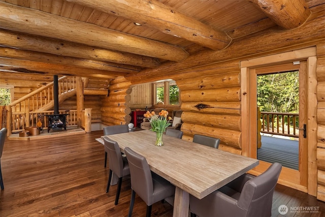 dining space featuring beamed ceiling, wooden ceiling, and a healthy amount of sunlight