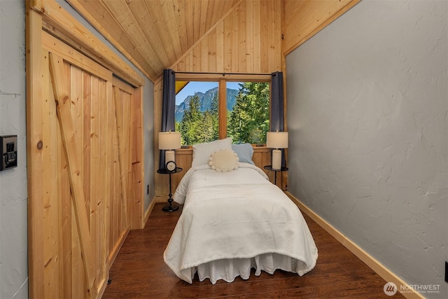 bedroom with dark wood-type flooring, wood ceiling, baseboards, and vaulted ceiling