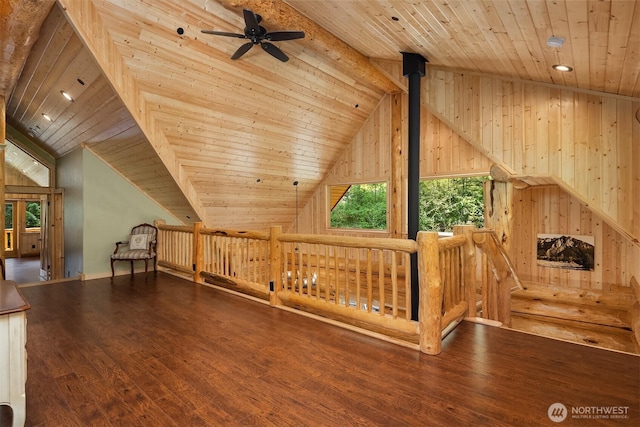 additional living space featuring lofted ceiling with beams, a ceiling fan, and wooden ceiling