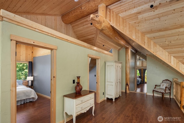 hall with wood-type flooring, lofted ceiling with beams, wood ceiling, and baseboards