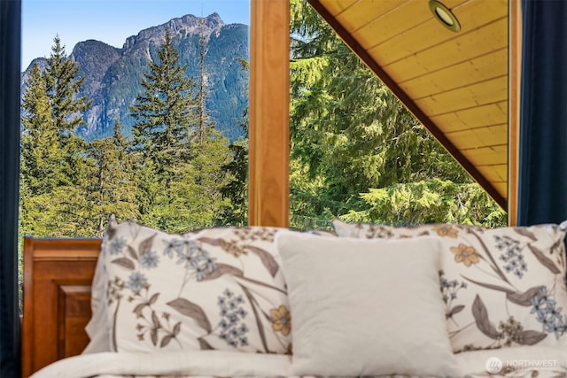 interior details featuring a forest view and a mountain view