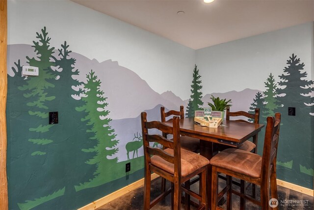 dining room with baseboards