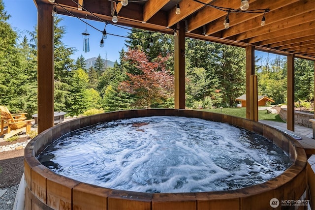 exterior space with a hot tub