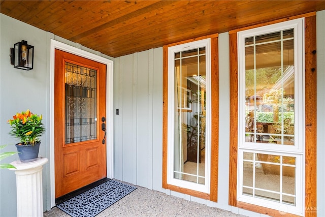 view of exterior entry with a porch