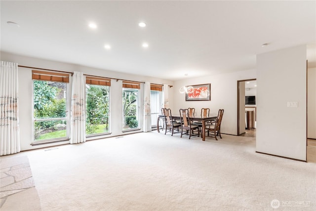 dining space featuring visible vents, recessed lighting, and light colored carpet