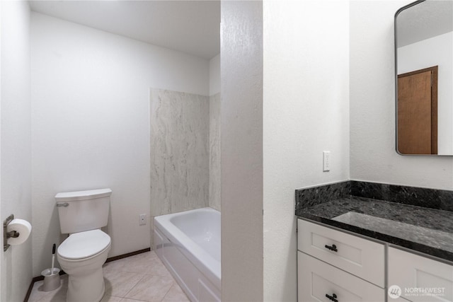 bathroom featuring toilet, tile patterned flooring, and vanity