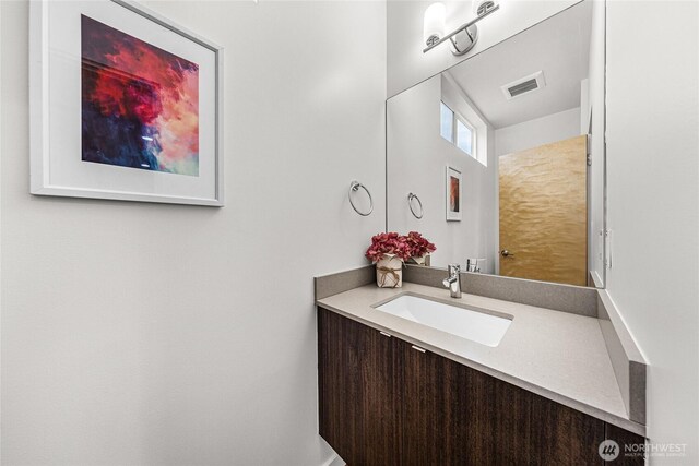bathroom featuring visible vents and vanity
