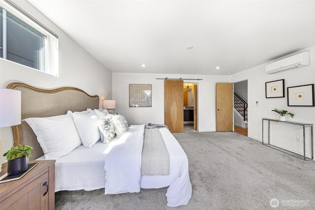 carpeted bedroom featuring a wall unit AC and recessed lighting