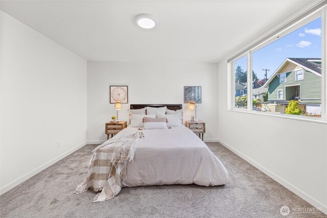 carpeted bedroom with baseboards
