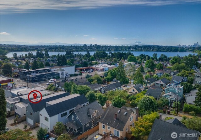 aerial view featuring a residential view and a water view