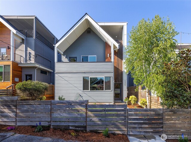 modern home with a fenced front yard