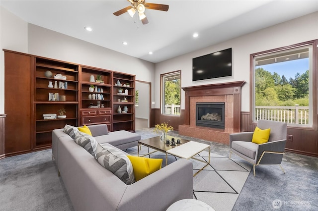 23615 38th Ave E, Spanaway, WA 98387 - living area featuring a high end fireplace, a ceiling fan, carpet flooring, and recessed lighting