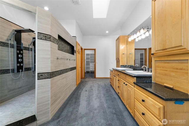 23615 38th Ave E, Spanaway, WA 98387 - bathroom with a walk in shower, a skylight, double vanity, baseboards, and recessed lighting