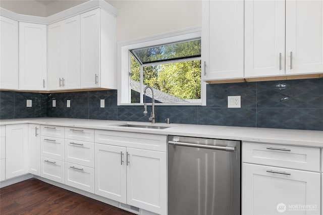 23615 38th Ave E, Spanaway, WA 98387 - kitchen featuring stainless steel dishwasher, a sink, light countertops, and dark wood-style floors