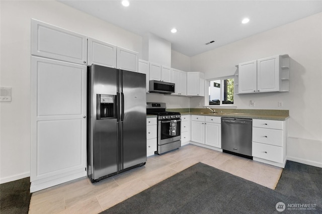 23615 38th Ave E, Spanaway, WA 98387 - kitchen with stainless steel appliances, white cabinetry, dark countertops, a sink, and recessed lighting